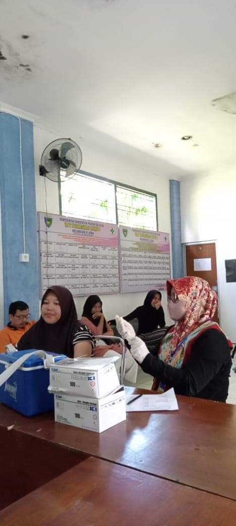 PELAKSANAAN PELAYANAN VAKSINASI COVID-19  DI UPT PUSKESMAS LUMPO