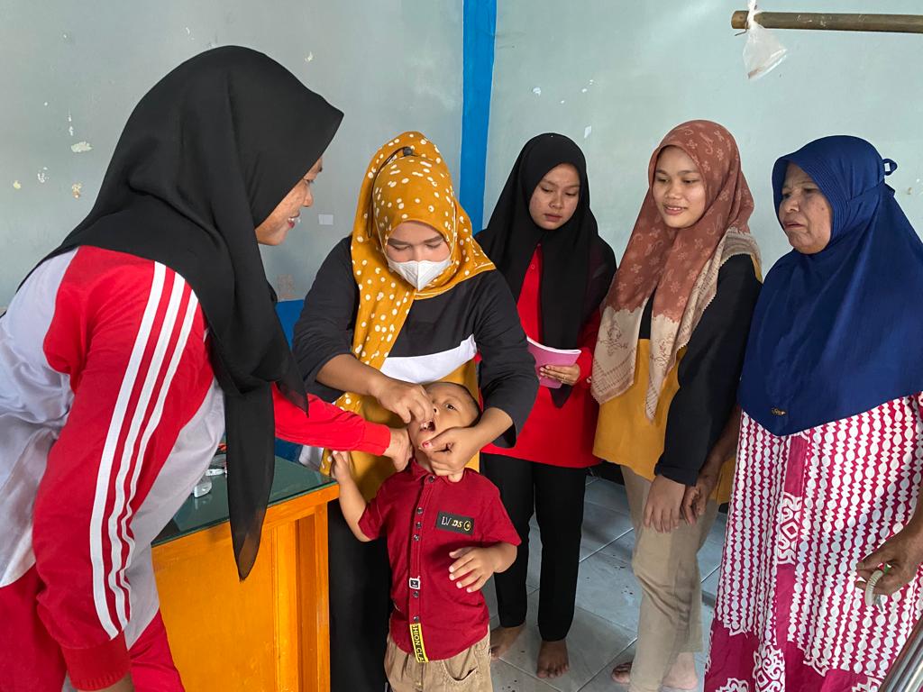 PELAKSANAAN PENIMBANGAN MASSAL DAN BULAN PEMBERIAN VIT.A DI POSYANDU  PUSKESMAS PASAR BARU