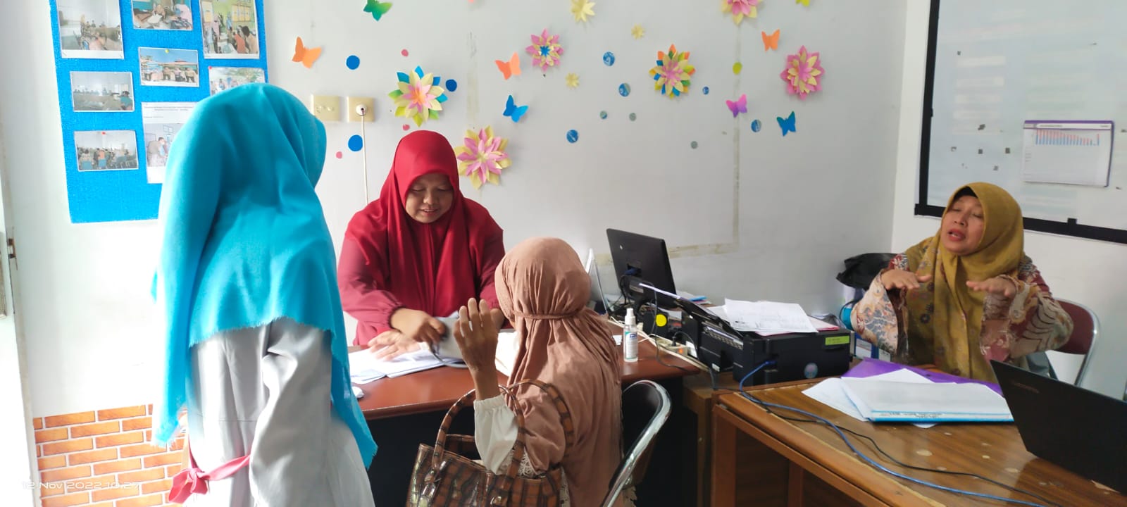 VAKSINASI COVID 19 DI UPT PUSKESMAS PASAR BARU