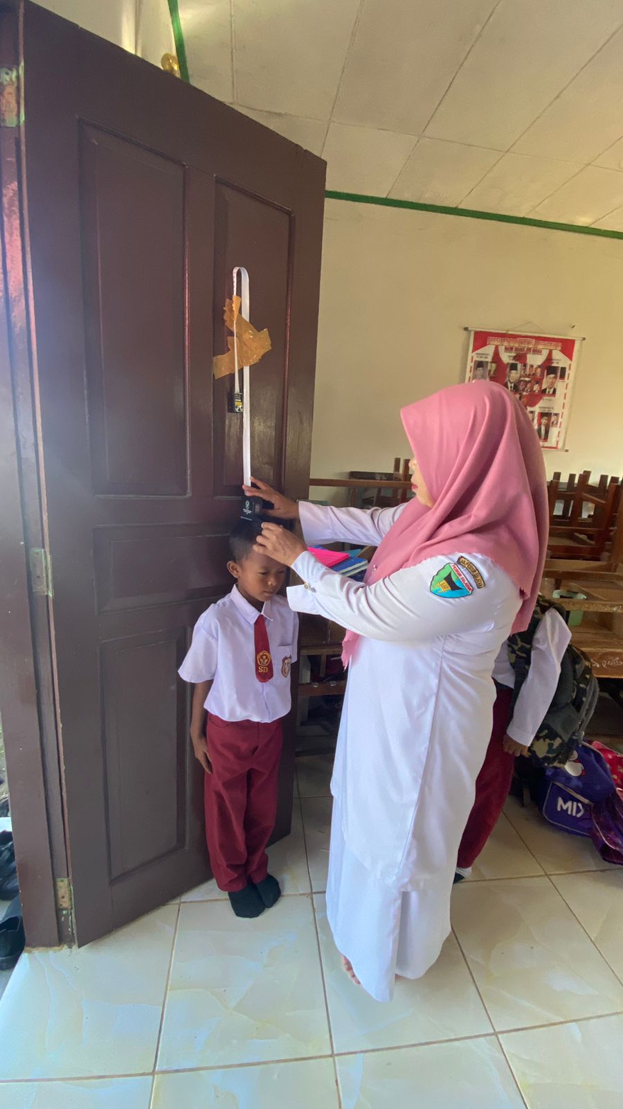 SKIRINING KESEHATAN MURID BARU DI SDN 11 TARANDAM BATU HAMPAR WILAYAH KERJA PUSKESMAS TARUSAN