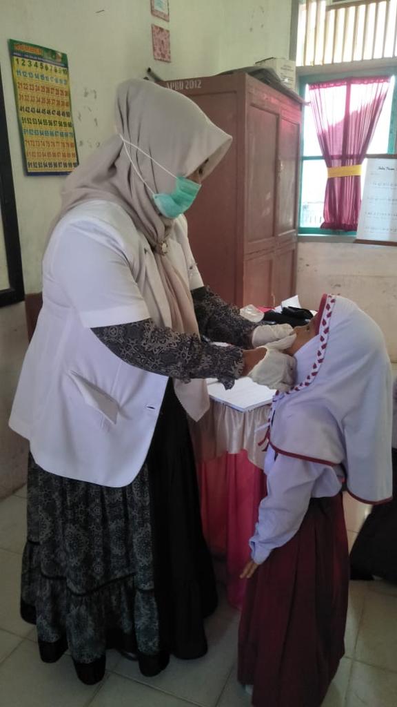 PENJARINGAN KESEHATAN ANAK SEKOLAH DAN PEMBERIAN OBAT CACING DI SEKOLAH DASAR YANG ADA  DI WILAYAH K