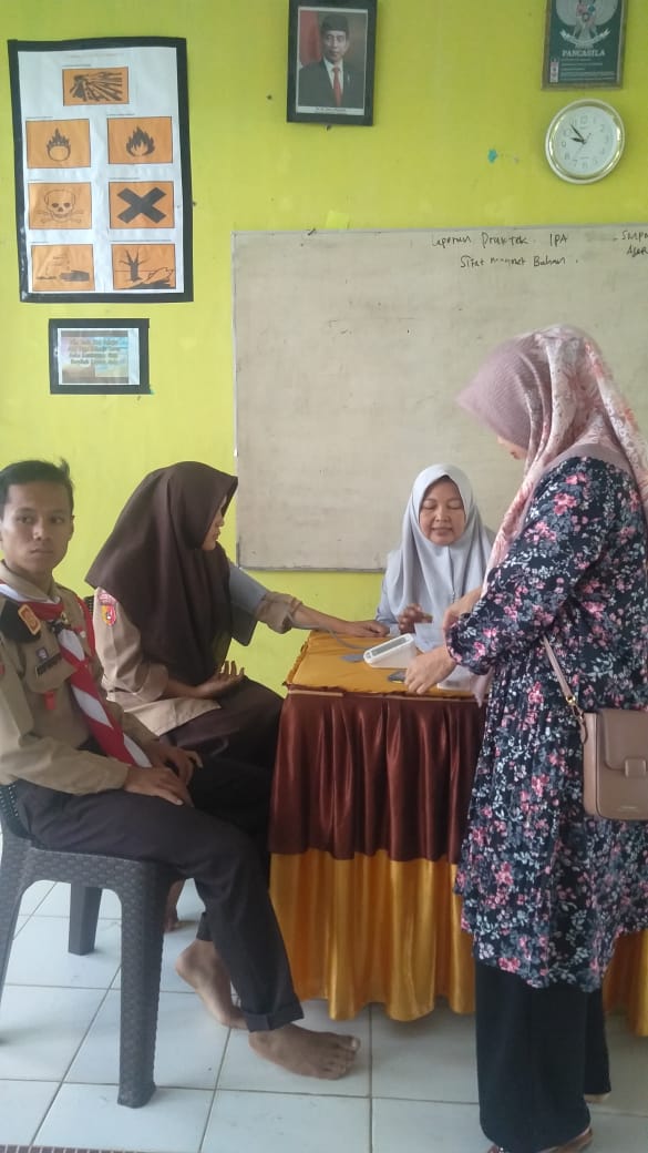 Skrining PTM di SMP Negeri 2 Airpura