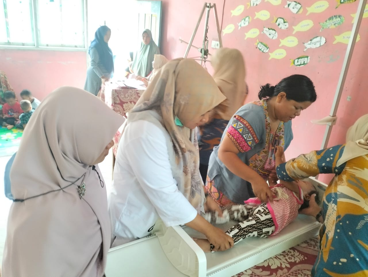 PUSKESMAS IV KOTO PENIMBANGAN MASSAL DI POSYANDU