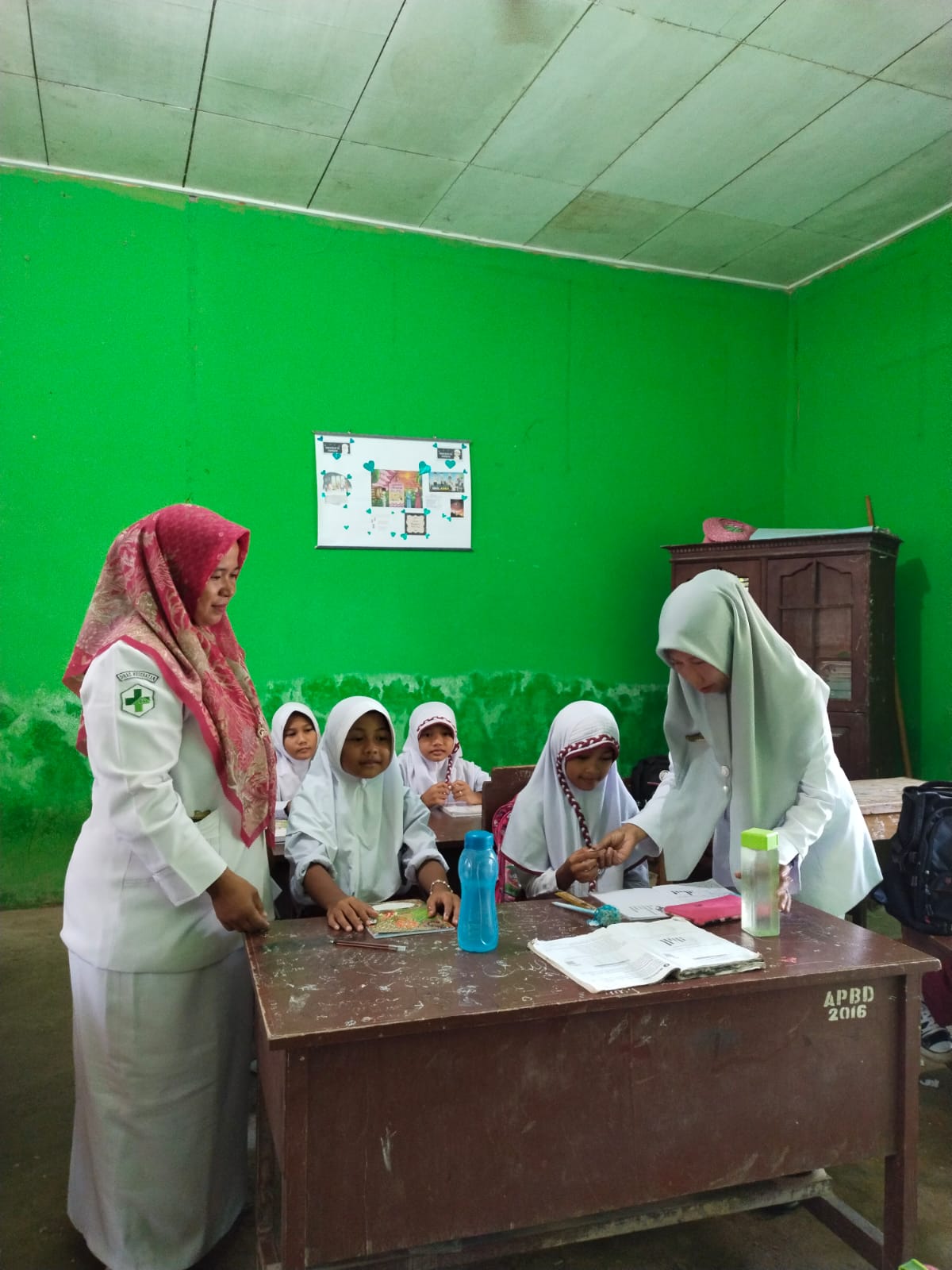 PUSKESMAS IV KOTO MUDIK PEMBERIAN OBAT PENCEGAHAN SECARA MASSAL CACINGAN (POPM)