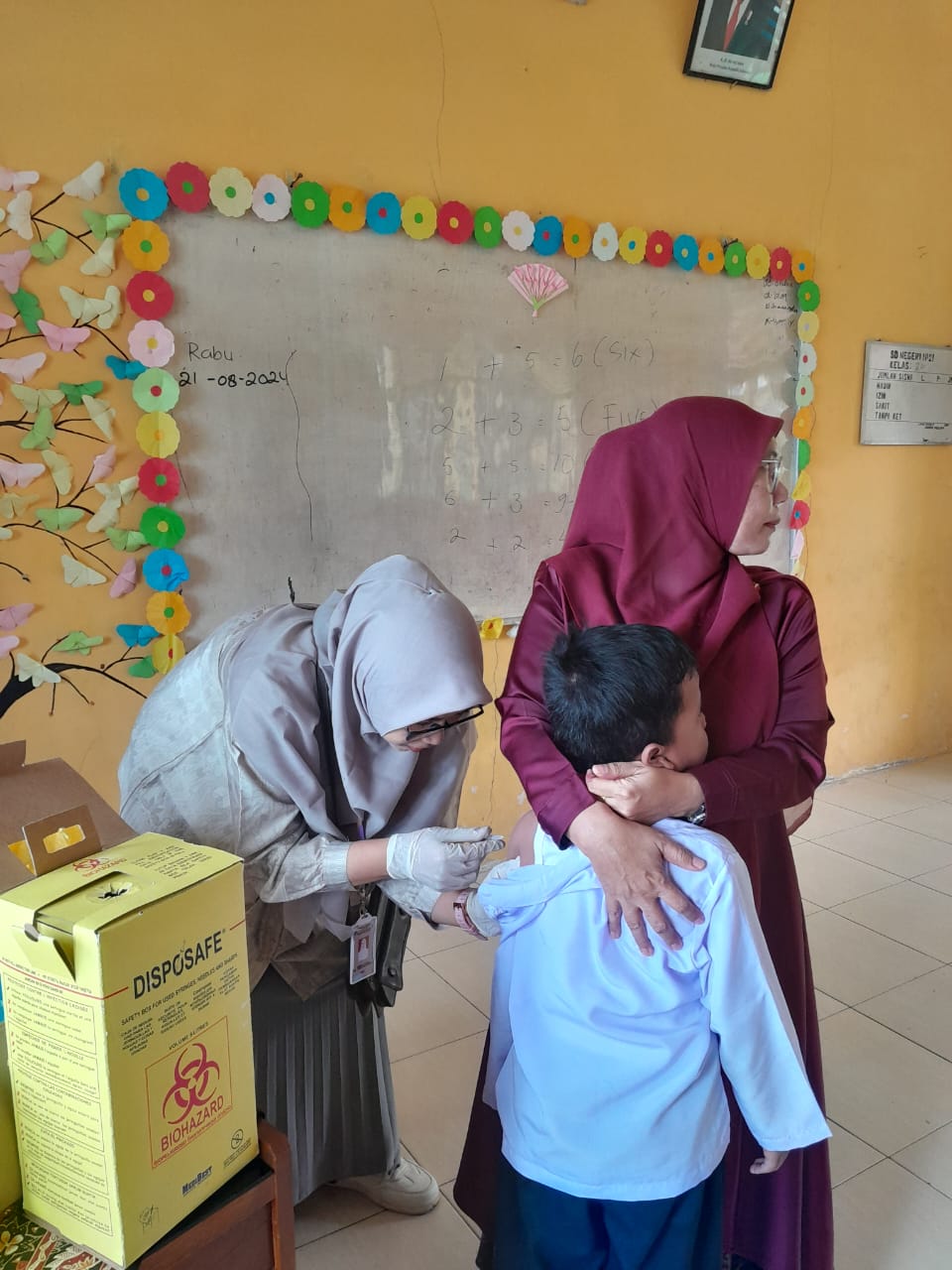 BULAN IMUNISASI ANAK SEKOLAH PUSKESMAS PASAR KUOK