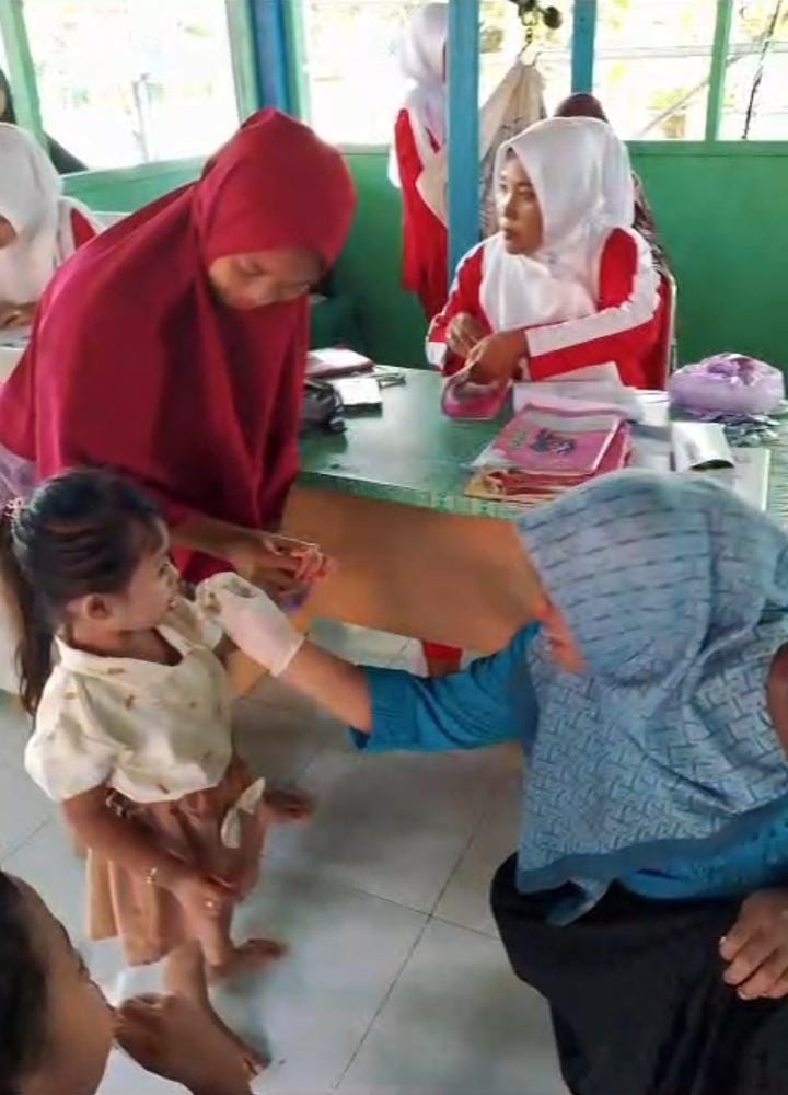 Pemberian Obat Cacing Pencegahan Massal di Posyandu Wilayah Kerja Puskesmas Tanjung Beringin